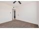 Bright bedroom with carpet flooring and ceiling fan, providing a serene space at 6823 W Coolidge St, Phoenix, AZ 85033