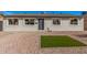 Charming single-story home with gray brick and a well-maintained xeriscaped front yard at 6823 W Coolidge St, Phoenix, AZ 85033
