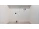 Efficient laundry area with tile flooring, ready for washer and dryer hookups at 6823 W Coolidge St, Phoenix, AZ 85033