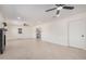 Living room with tile flooring, recessed lights, ceiling fans and backyard access at 6823 W Coolidge St, Phoenix, AZ 85033