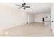 Open-concept living room featuring recessed lighting and neutral tile flooring throughout at 6823 W Coolidge St, Phoenix, AZ 85033