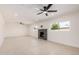 Bright and spacious living room featuring a modern fireplace and tile flooring at 6823 W Coolidge St, Phoenix, AZ 85033