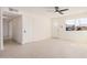 Living room features recessed lighting, neutral tile, and a view of the front door at 6823 W Coolidge St, Phoenix, AZ 85033