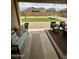 Inviting backyard with artificial turf, desert landscaping, and comfortable lounge seating at 905 S 108Th Ave, Avondale, AZ 85323