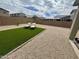 Spacious backyard featuring desert landscaping with artificial turf and a lounge chairs at 905 S 108Th Ave, Avondale, AZ 85323