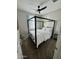 Contemporary bedroom showcasing a black canopy bed with white bedding and a modern ceiling fan at 905 S 108Th Ave, Avondale, AZ 85323
