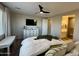 Relaxing bedroom featuring a comfortable bed, TV, and ensuite bathroom for added convenience at 905 S 108Th Ave, Avondale, AZ 85323