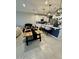 Inviting dining area with modern lighting adjacent to kitchen at 905 S 108Th Ave, Avondale, AZ 85323