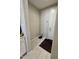 Neutral entryway area featuring tile floor and a dark accent rug at 905 S 108Th Ave, Avondale, AZ 85323