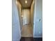 Hallway with beige walls and tile flooring leading to various rooms at 905 S 108Th Ave, Avondale, AZ 85323
