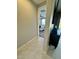 Hallway view leads to a bedroom with natural light and a ceiling fan at 905 S 108Th Ave, Avondale, AZ 85323
