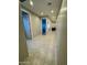 Spacious hallway with tile flooring, recessed lighting, and several doorways at 905 S 108Th Ave, Avondale, AZ 85323