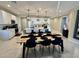 Open-concept kitchen and dining area filled with natural light at 905 S 108Th Ave, Avondale, AZ 85323