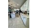 Bright kitchen with white cabinets, stainless appliances, and a center island at 905 S 108Th Ave, Avondale, AZ 85323