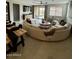 Inviting living room with a comfortable wrap-around sofa, fireplace, and lots of natural light at 905 S 108Th Ave, Avondale, AZ 85323