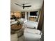Open-concept living room with modern furnishings, a large TV, and a stylish area rug at 905 S 108Th Ave, Avondale, AZ 85323