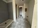 A partially constructed bathroom with unfinished drywall, plumbing and concrete shower base at 9543 W Parkway Dr, Tolleson, AZ 85353