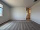 Spacious bedroom with carpeted floors and ample natural light at 9543 W Parkway Dr, Tolleson, AZ 85353