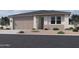 Charming single-story home featuring a two-car garage, neutral stucco siding, and low maintenance desert landscaping at 9543 W Parkway Dr, Tolleson, AZ 85353