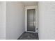 Close-up shot of a stylish front door and textured exterior wall providing a welcoming entrance at 9543 W Parkway Dr, Tolleson, AZ 85353