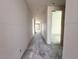 Unfinished hallway with smooth flooring and multiple doorways leading to various rooms at 9543 W Parkway Dr, Tolleson, AZ 85353