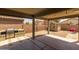 Covered patio area with stainless steel grill, built-in counter, and storage shed in the backyard at 10621 W Pima St, Tolleson, AZ 85353