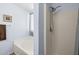 Clean bathroom featuring a tub, separate shower, and neutral color scheme at 10621 W Pima St, Tolleson, AZ 85353