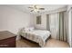 Cozy bedroom with a comfortable bed, soft lighting, and neutral decor at 10621 W Pima St, Tolleson, AZ 85353