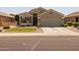 Charming single-story home with a desert landscape and well-maintained front yard at 10621 W Pima St, Tolleson, AZ 85353
