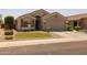 Charming single-story home with a desert landscape and well-maintained front yard at 10621 W Pima St, Tolleson, AZ 85353