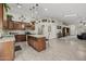 Spacious kitchen with a center island, granite countertops and stainless steel appliances at 10621 W Pima St, Tolleson, AZ 85353