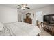 Serene main bedroom with neutral decor and a view into the ensuite bathroom at 10621 W Pima St, Tolleson, AZ 85353