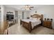 Comfortable main bedroom with a king-size bed, neutral decor, and tiled floors at 10621 W Pima St, Tolleson, AZ 85353
