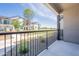 Balcony view of the landscaped grounds and neighboring townhouses at 11300 N Casa Dega Dr # 1027, Surprise, AZ 85388
