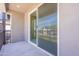Balcony with sliding glass door provides natural light to the home at 11300 N Casa Dega Dr # 1027, Surprise, AZ 85388
