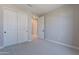 Bedroom featuring carpet floors, walk-in closet, and lots of light at 11300 N Casa Dega Dr # 1027, Surprise, AZ 85388