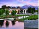 A charming community center next to a reflecting pool with mountains in the distance at 11300 N Casa Dega Dr # 1027, Surprise, AZ 85388