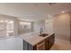 Modern kitchen island with stainless steel appliances and granite countertops offers ample workspace and storage at 11300 N Casa Dega Dr # 1027, Surprise, AZ 85388