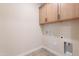 Bright laundry room showcasing cabinetry and utility connections at 11300 N Casa Dega Dr # 1027, Surprise, AZ 85388