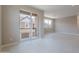 Open living area with tile floors, bright light and balcony at 11300 N Casa Dega Dr # 1027, Surprise, AZ 85388