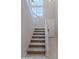 Bright entryway featuring a carpeted staircase with white banister and a large window at 11300 N Casa Dega Dr # 1027, Surprise, AZ 85388