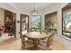Cozy breakfast nook with lovely views of the outdoor patio and mature desert landscaping at 11821 S Tuzigoot Ct, Phoenix, AZ 85044