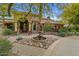 Inviting circular driveway leads to this home with a central fountain and beautiful desert landscaping at 11821 S Tuzigoot Ct, Phoenix, AZ 85044