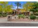 Beautiful home with desert landscaping, a circular driveway, and a stone mailbox at 11821 S Tuzigoot Ct, Phoenix, AZ 85044