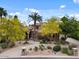 Beautiful home with desert landscaping, a circular driveway, and a stone mailbox at 11821 S Tuzigoot Ct, Phoenix, AZ 85044