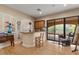 Stylish living room with a wet bar and sliding glass doors to the outdoor patio at 11821 S Tuzigoot Ct, Phoenix, AZ 85044