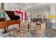 Living room with high ceilings, travertine flooring, neutral walls, and open floorplan at 11821 S Tuzigoot Ct, Phoenix, AZ 85044