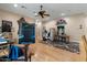 Stylish living room with a ceiling fan and beautiful light wood floors and a decorative rug at 11821 S Tuzigoot Ct, Phoenix, AZ 85044