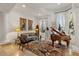Living room with high ceilings, travertine flooring, light walls, and large windows at 11821 S Tuzigoot Ct, Phoenix, AZ 85044