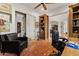 Well-appointed office space with a built-in bookcase, a comfy chair, and an area rug at 11821 S Tuzigoot Ct, Phoenix, AZ 85044